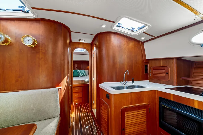 Pipe Dreams Yacht Photos Pics Luxurious 2002 Hinckley Talaria 44 Express yacht interior with wood finish and modern amenities.