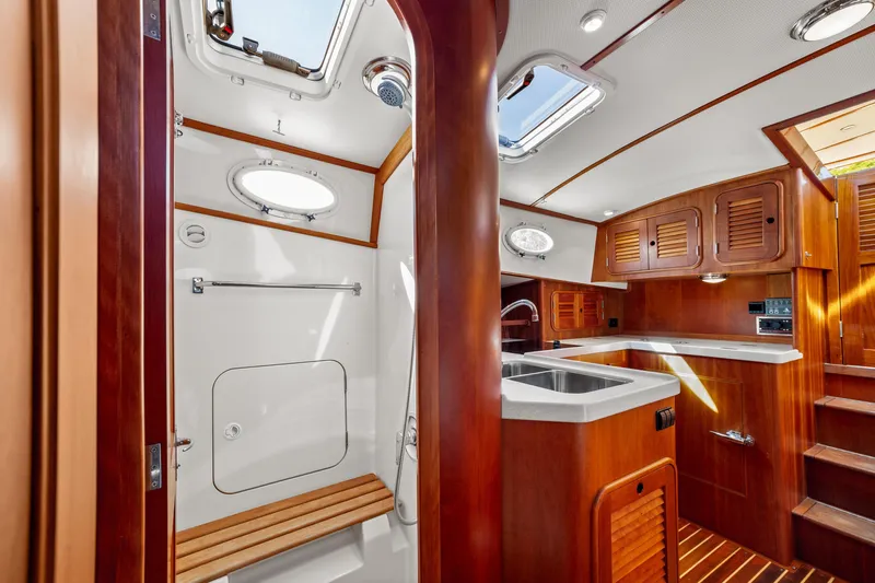 Pipe Dreams Yacht Photos Pics Interior of 2002 Hinckley Talaria 44 Express yacht with wooden cabinetry and modern fixtures.