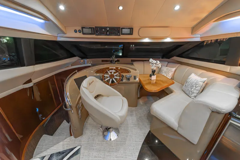 Believe Yacht Photos Pics Luxurious 2004 Marquis Motor Yacht interior with plush seating and elegant helm station.