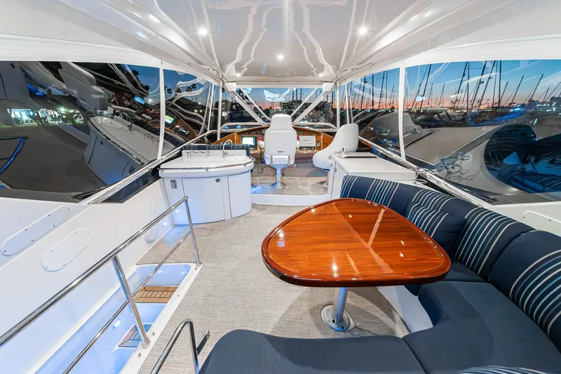 Believe Yacht Photos Pics Luxurious 2004 Marquis Motor Yacht interior with elegant seating and polished wood table.