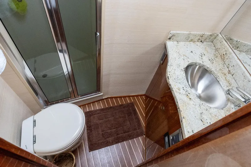 "five Seas" Yacht Photos Pics Luxurious bathroom in 2007 Viking 64 Convertible yacht with granite countertop and shower.