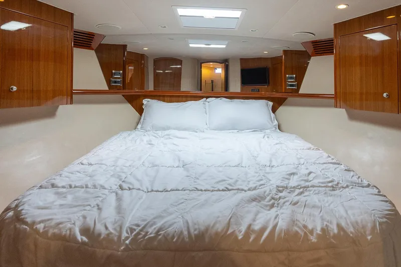 "five Seas" Yacht Photos Pics Luxurious cabin interior of 2007 Viking 64 Convertible yacht with cozy bedding.
