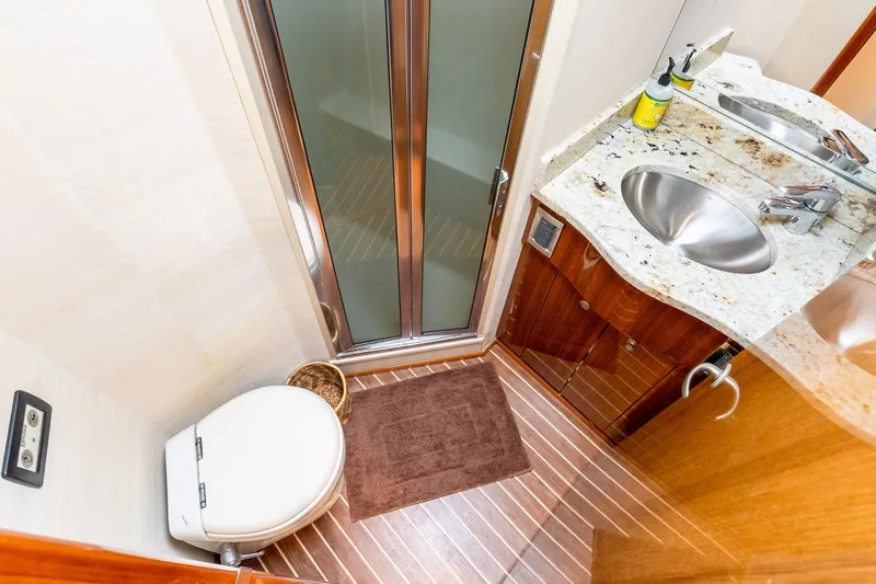 "five Seas" Yacht Photos Pics Luxurious bathroom in 2007 Viking 64 Convertible yacht with granite countertop and modern fixtures.