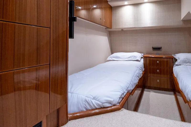 "five Seas" Yacht Photos Pics Luxurious cabin interior of 2007 Viking 64 Convertible yacht with twin beds.