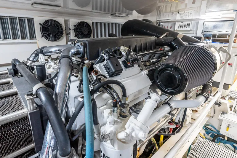 "five Seas" Yacht Photos Pics Engine room of 2007 Viking 64 Convertible yacht, showcasing detailed machinery and components.