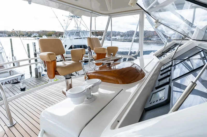 "five Seas" Yacht Photos Pics 2007 Viking 64 Convertible yacht helm with luxurious seating and advanced navigation controls.