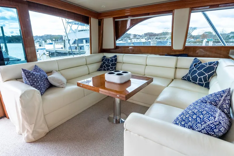 "five Seas" Yacht Photos Pics Luxurious interior of 2007 Viking 64 Convertible yacht with plush seating and elegant decor.