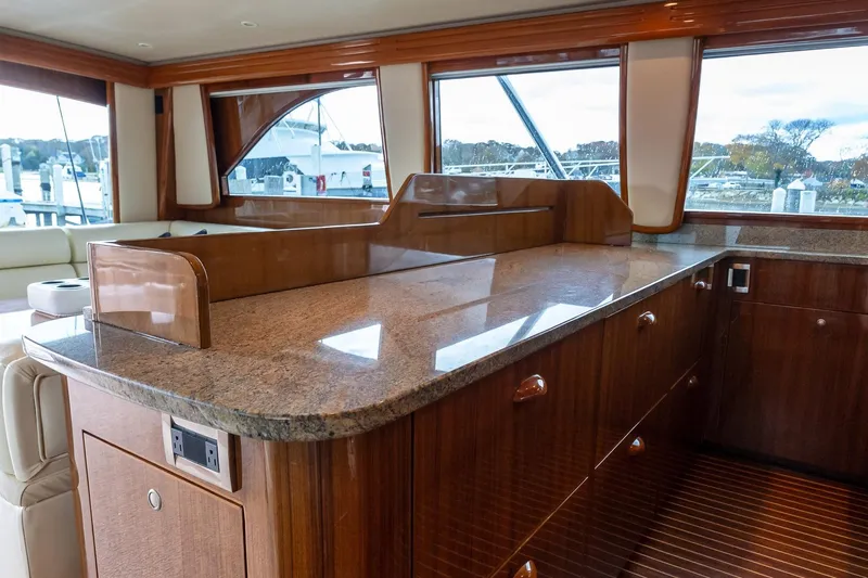 "five Seas" Yacht Photos Pics Luxurious interior of 2007 Viking 64 Convertible yacht with polished wood and granite finishes.