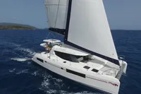 2019 Leopard 45 sailing catamaran cruising on open blue sea.