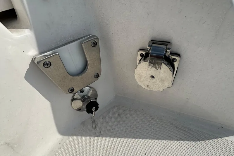  Yacht Photos Pics 2024 Regal 26 XO boat detail showing key lock and power outlet.