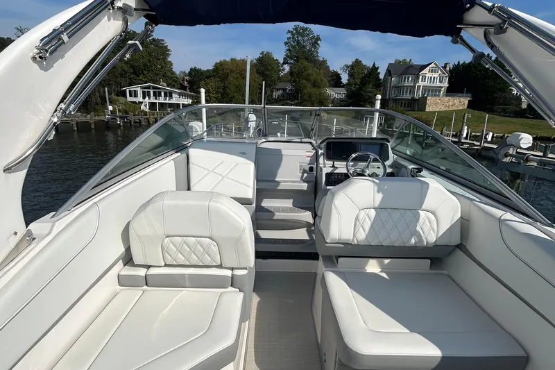  Yacht Photos Pics 2024 Regal 26 XO boat interior with white seating and modern dashboard.