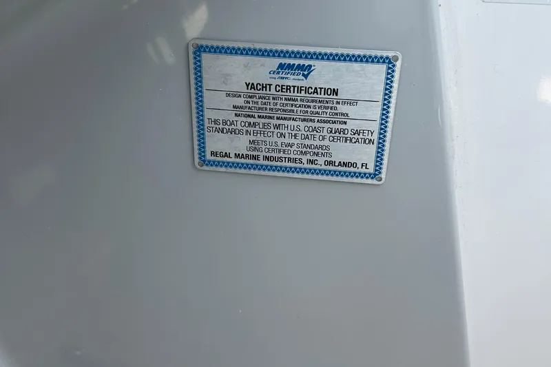  Yacht Photos Pics 2024 Regal 26 XO yacht certification plaque, compliance with U.S. Coast Guard safety standards.