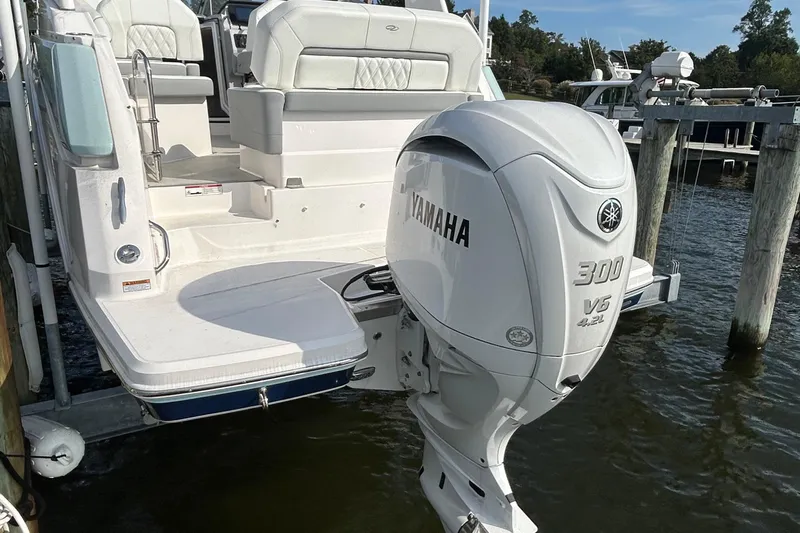  Yacht Photos Pics 2024 Regal 26 XO boat with Yamaha 300 V6 outboard engine at dock.