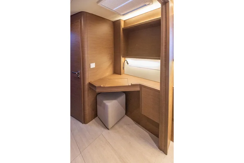 Grace Yacht Photos Pics Luxurious wooden interior of 2020 Lagoon 52 F yacht with desk and seating.