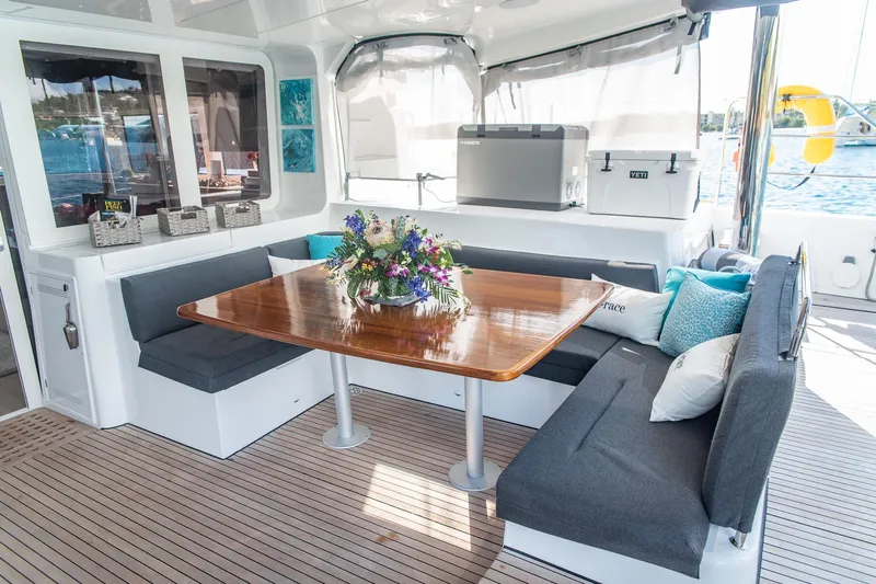 Grace Yacht Photos Pics Luxurious Lagoon 52 F 2020 yacht interior with elegant seating and floral centerpiece.
