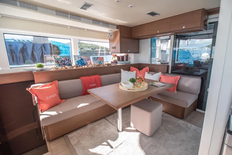 Grace Yacht Photos Pics Luxurious interior of 2020 Lagoon 52 F yacht with elegant seating and decor.