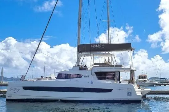 Sea Breeze Yacht Photos Pics 2023 Bali 5.4 catamaran docked under a bright blue sky.