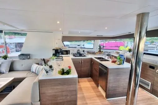 Sea Breeze Yacht Photos Pics Luxurious interior of 2023 Bali 5.4 yacht with modern kitchen and seating area.