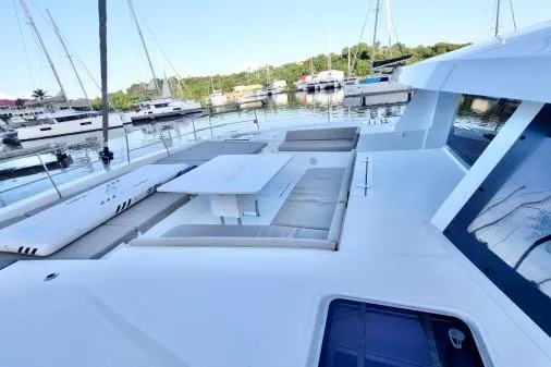 Sea Breeze Yacht Photos Pics Modern Bali 5.4 yacht deck, 2023 model, docked in a serene marina setting.