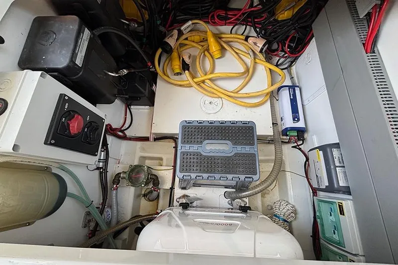  Yacht Photos Pics Engine compartment of 2023 Beneteau Antares 11 with cables and equipment.