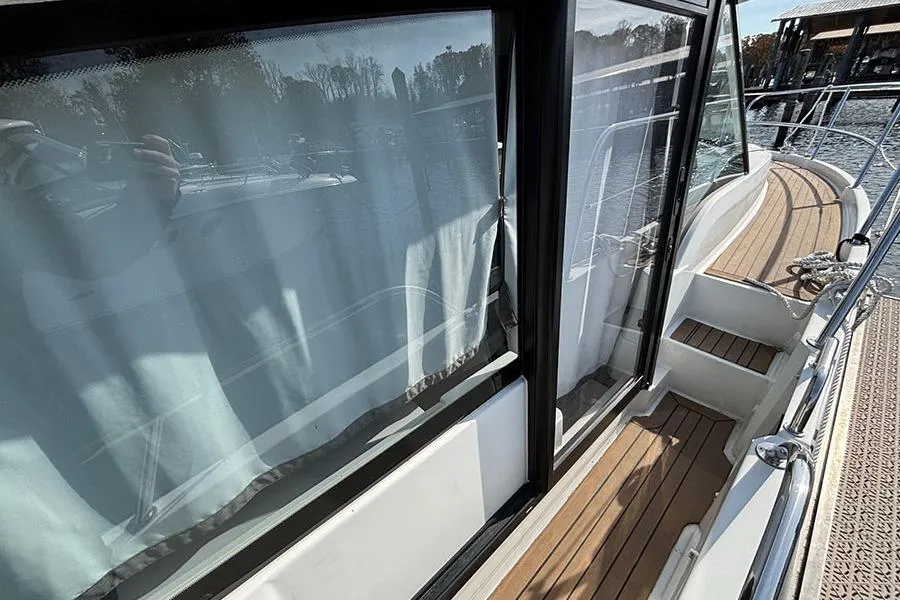 2023 Beneteau Antares 11 yacht with sleek deck and large windows.