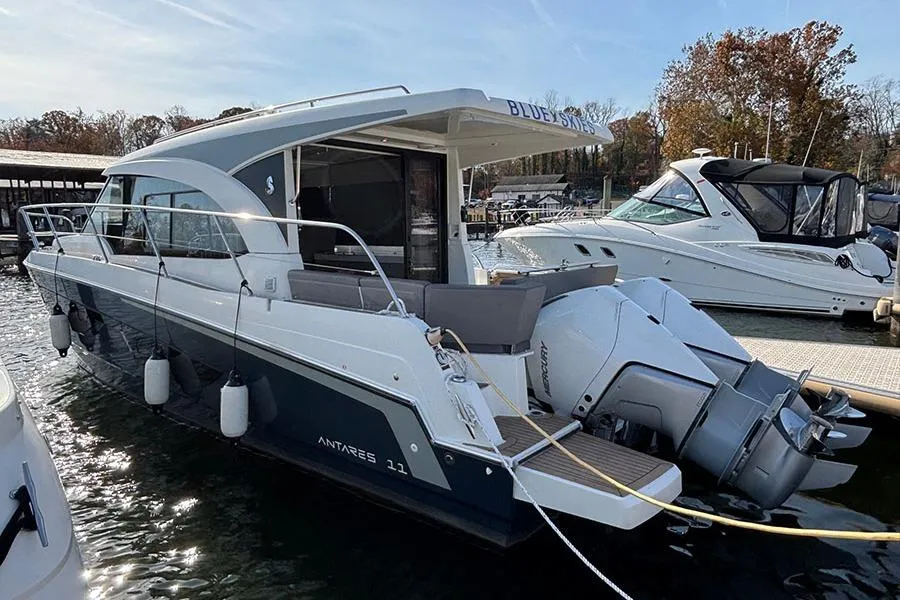 2023 Beneteau Antares 11 boat docked, featuring sleek design and powerful outboard engines.