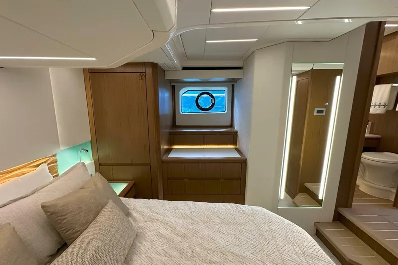 Just Fine Yacht Photos Pics Luxurious 2025 Tiara Yachts EX 60 cabin interior with modern design and elegant wood finishes.
