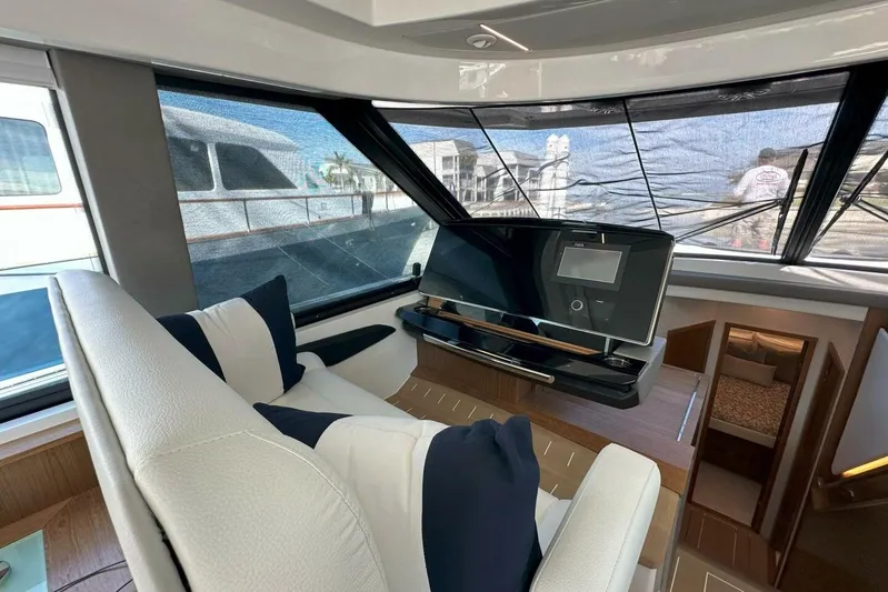 Just Fine Yacht Photos Pics 2025 Tiara Yachts EX 60 interior helm with modern controls and luxurious seating.
