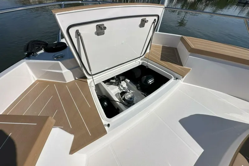 Just Fine Yacht Photos Pics Open hatch on 2025 Tiara Yachts EX 60, revealing storage compartment.