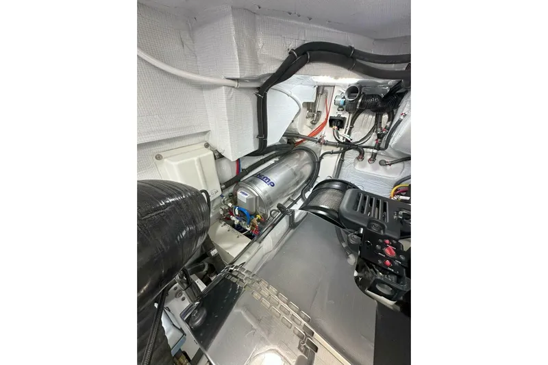 Just Fine Yacht Photos Pics Engine room of 2025 Tiara Yachts EX 60, showcasing advanced mechanical components.