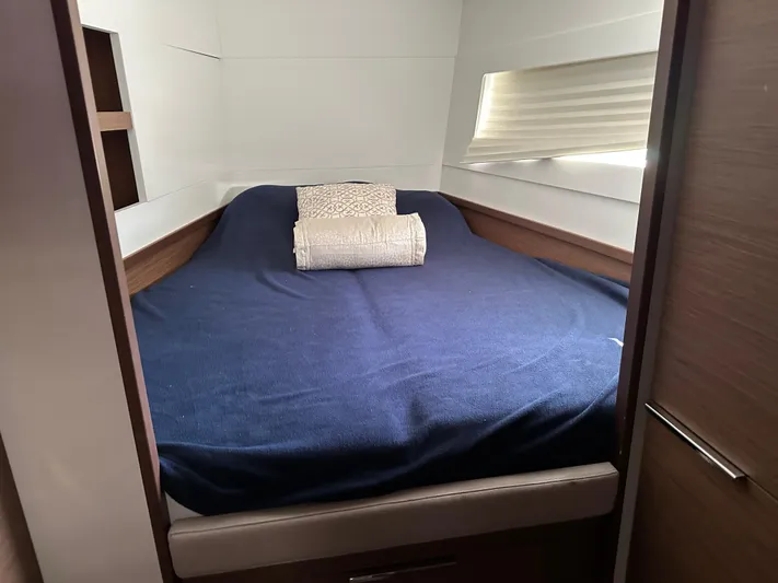  Yacht Photos Pics Cozy cabin interior of 2020 Lagoon 40 catamaran with a neatly made bed.