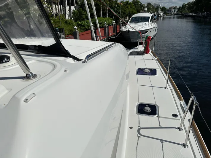  Yacht Photos Pics 2020 Lagoon 40 catamaran docked in a serene marina setting.