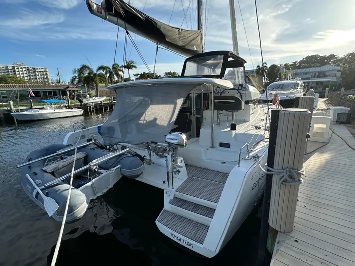  Yacht Photos Pics 2020 Lagoon 40 catamaran docked at marina, featuring modern design and spacious deck.