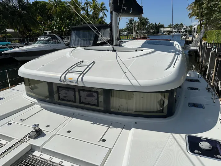  Yacht Photos Pics 2020 Lagoon 40 catamaran docked, featuring sleek design and spacious deck.