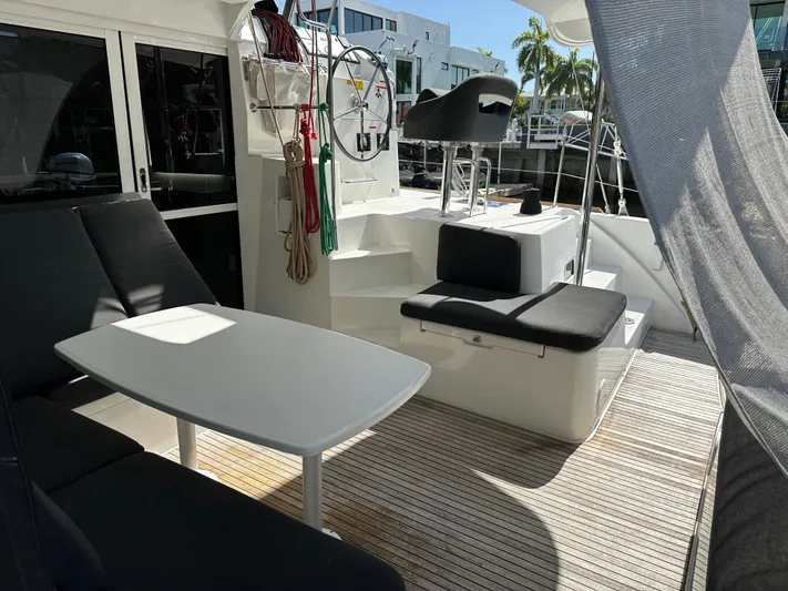  Yacht Photos Pics Spacious deck of 2020 Lagoon 40 catamaran with seating and helm station.