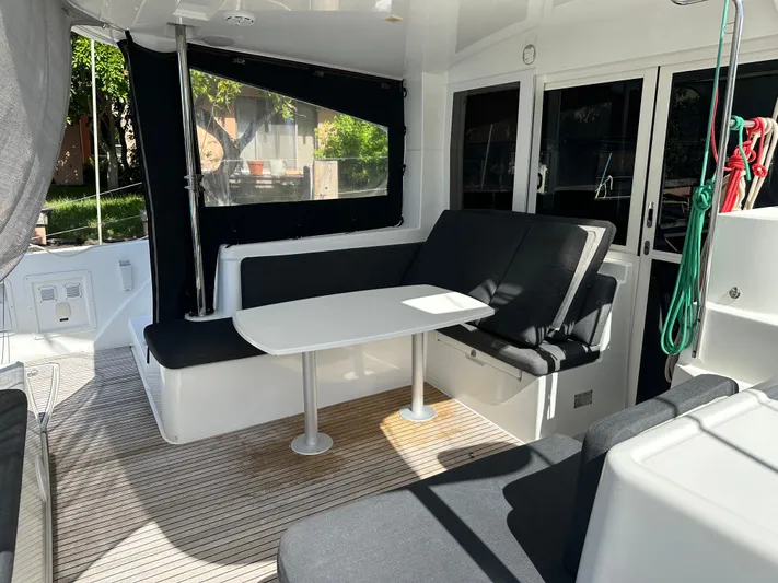  Yacht Photos Pics 2020 Lagoon 40 yacht interior with seating and table, featuring modern design and natural lighting.