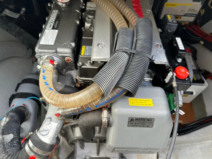  Yacht Photos Pics Engine compartment of a 2020 Lagoon 40 catamaran with visible hoses and components.