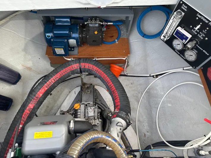  Yacht Photos Pics Engine room of a 2020 Lagoon 40 catamaran with mechanical components and control panel.