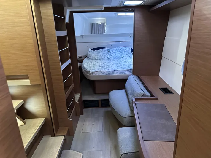  Yacht Photos Pics Interior of 2020 Lagoon 40 catamaran with cozy bedroom and modern wooden furnishings.