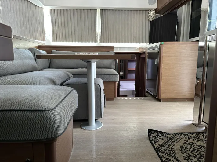  Yacht Photos Pics Interior of 2020 Lagoon 40 catamaran with modern seating and wooden finishes.