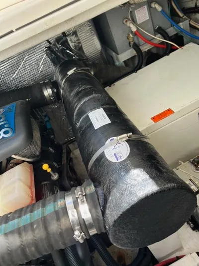 True Blue Yacht Photos Pics Engine compartment of a 2003 Cruisers Yachts 3772 Express with visible components.