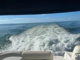 True Blue Yacht Photos Pics View from a 2003 Cruisers Yachts 3772 Express cruising on open water.