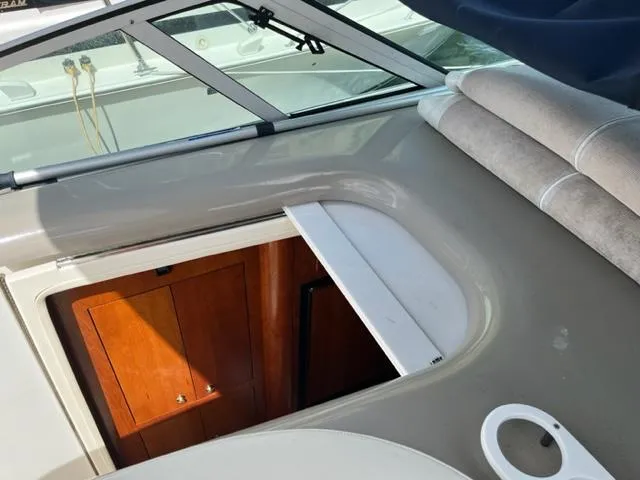 True Blue Yacht Photos Pics 2003 Cruisers Yachts 3772 Express interior cabin entrance with wooden door.