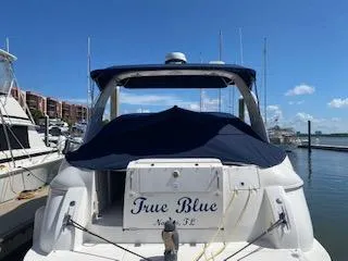 True Blue Yacht Photos Pics 2003 Cruisers Yachts 3772 Express True Blue docked at marina.