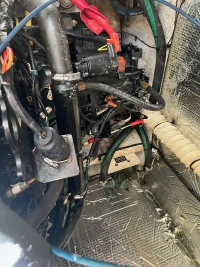 True Blue Yacht Photos Pics Engine compartment of a 2003 Cruisers Yachts 3772 Express with various mechanical components.