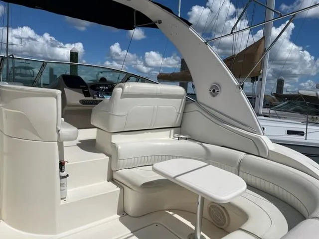 True Blue Yacht Photos Pics 2003 Cruisers Yachts 3772 Express boat interior with white seating and table.