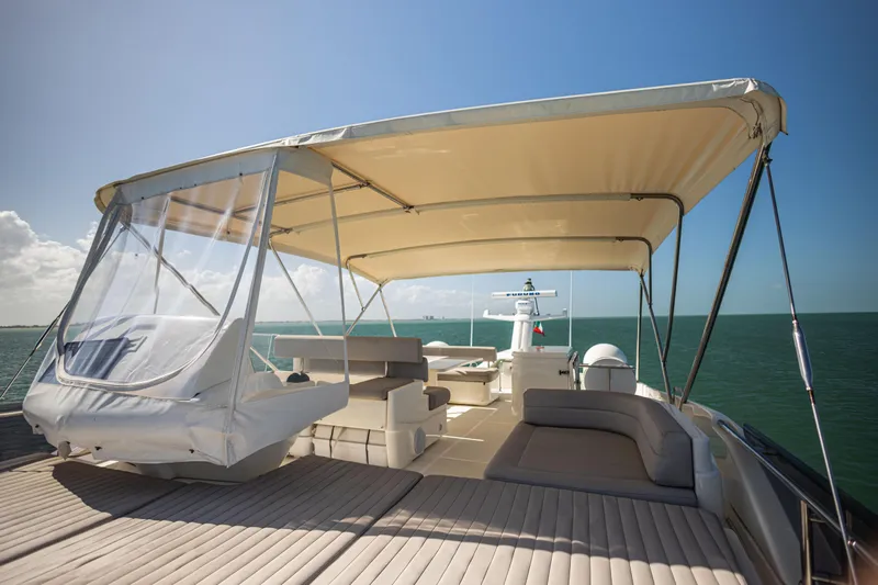 Navegante Yacht Photos Pics Luxurious 2013 Ferretti Yachts 690 with spacious deck and canopy on open sea.