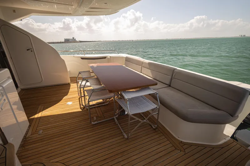 Navegante Yacht Photos Pics Luxurious 2013 Ferretti Yachts 690 deck with seating and ocean view.