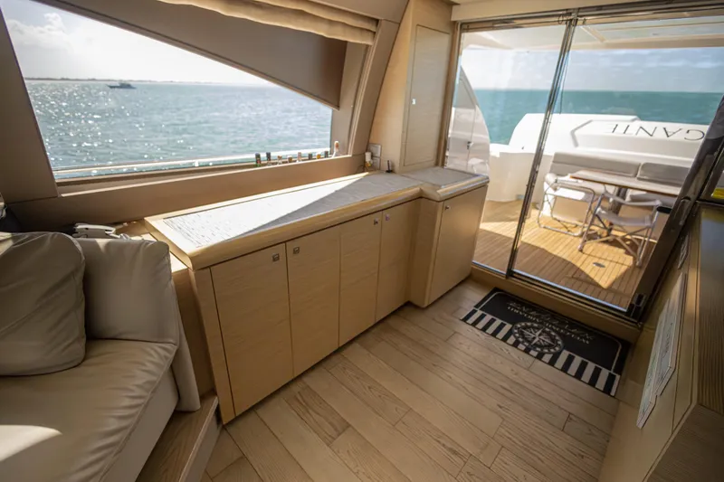 Navegante Yacht Photos Pics Luxurious interior of 2013 Ferretti Yachts 690 with ocean view and elegant wood finish.