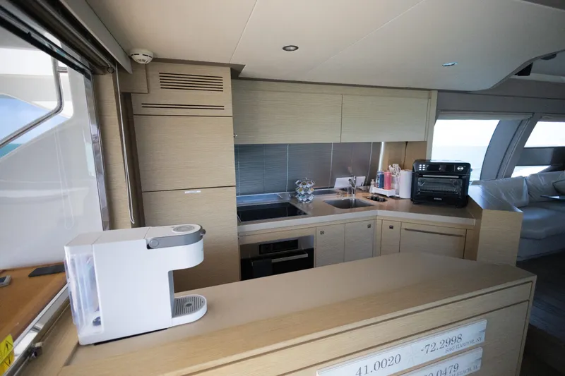 Navegante Yacht Photos Pics Modern kitchen interior on a 2013 Ferretti Yachts 690, featuring sleek appliances and cabinetry.